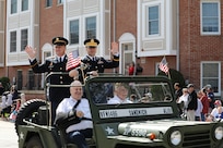Retired Sgt. Maj. Dennis Koski, left, formerly assigned to the 85th U.S. Army Reserve Support Command, waves in a jeep during the Arlington Heights Memorial Day parade and ceremony, May 26, 2025.