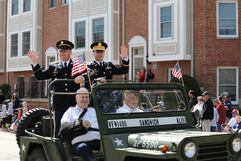 Retired Sgt. Maj. Dennis Koski, left, formerly assigned to the 85th U.S. Army Reserve Support Command, waves in a jeep during the Arlington Heights Memorial Day parade and ceremony, May 26, 2025.