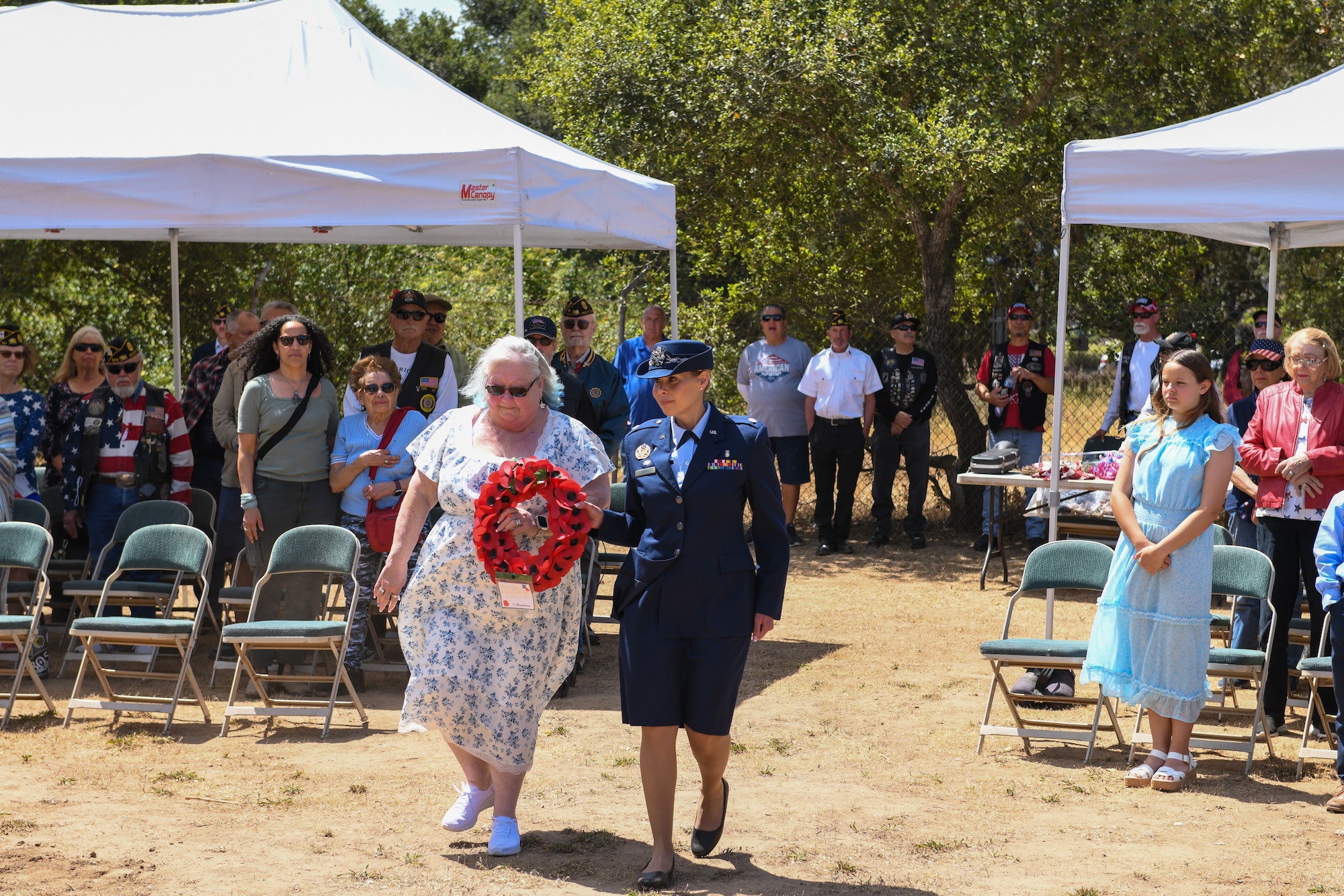 Nora Mainville, American Legion Post 534 1st Vice (Auxiliary), center left, and U.S. Air Force Lt. Col. Tonya Barry, 30th Healthcare Operations Squadron commander, center right, prepare to lay a wreath during a Memorial Day ceremony in Orcutt, Calif., May 26, 2025. Team Vandenberg leadership participated in Memorial Day ceremonies alongside community members in Lompoc, Santa Maria, Solvang, Orcutt, Ojai, and Santa Barbara. Collectively, they paid tribute to the fallen heroes who made the ultimate sacrifice in service and defense of our nation. (U.S. Space Force photo by Master Sgt. Eric Burks)