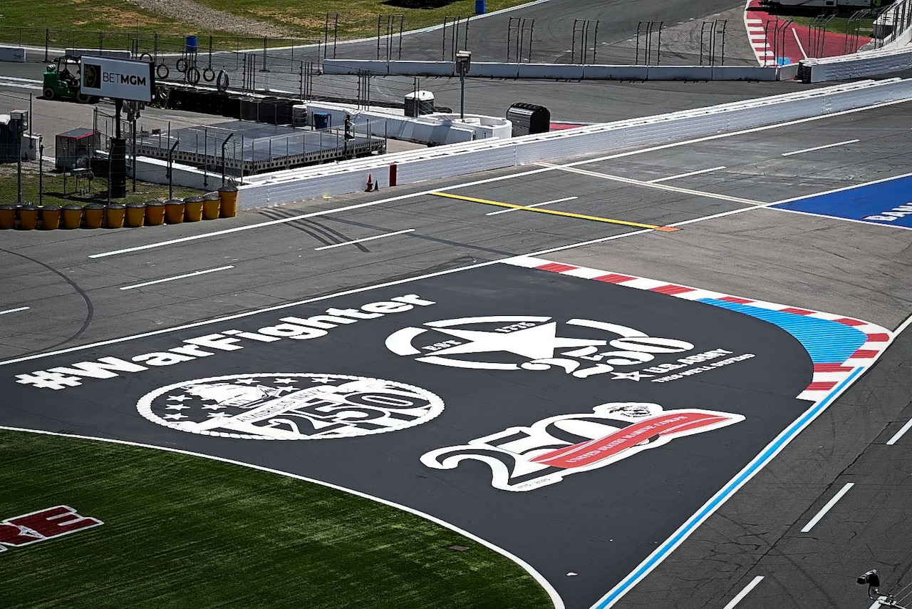 A racetrack with logos painted on it.