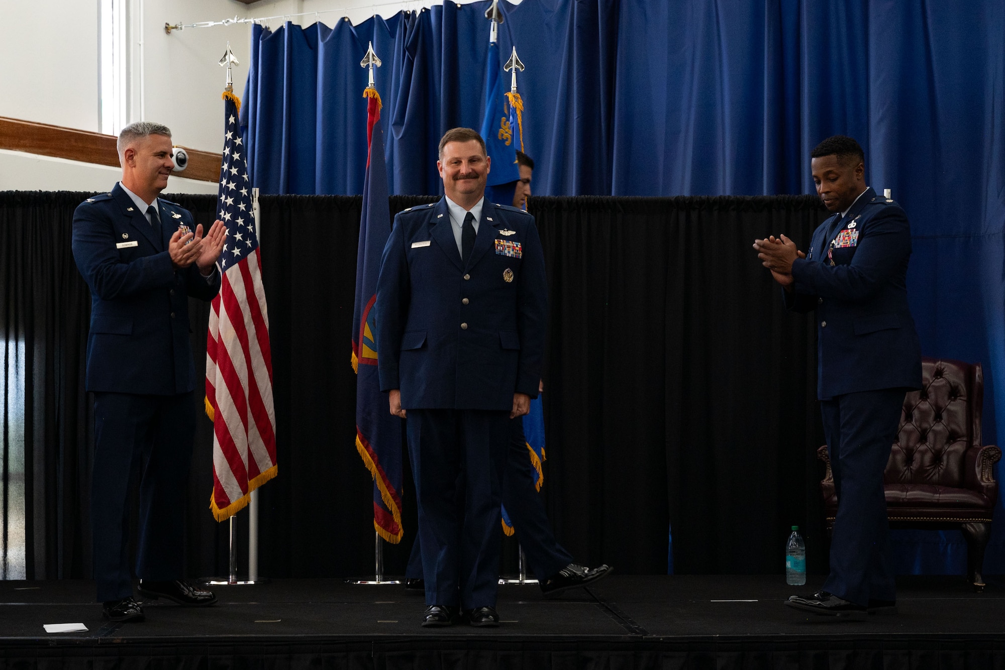 U.S. Air Force Lt. Col. Micah McCracken, 36th Operations Support Squadron Commander, assumes command during a change of command ceremony May 16, 2025, at Andersen Air Force Base, Guam. The passing of the guidon during the ceremony symbolizes the transfer of responsibilities from the outgoing commander to the incoming commander. (U.S. Air Force photo by Staff Sgt. Jasmine M. Barnes)