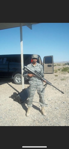 Then Sgt. Joshua Willis holding a rifle during a training event. (Courtesy photo)