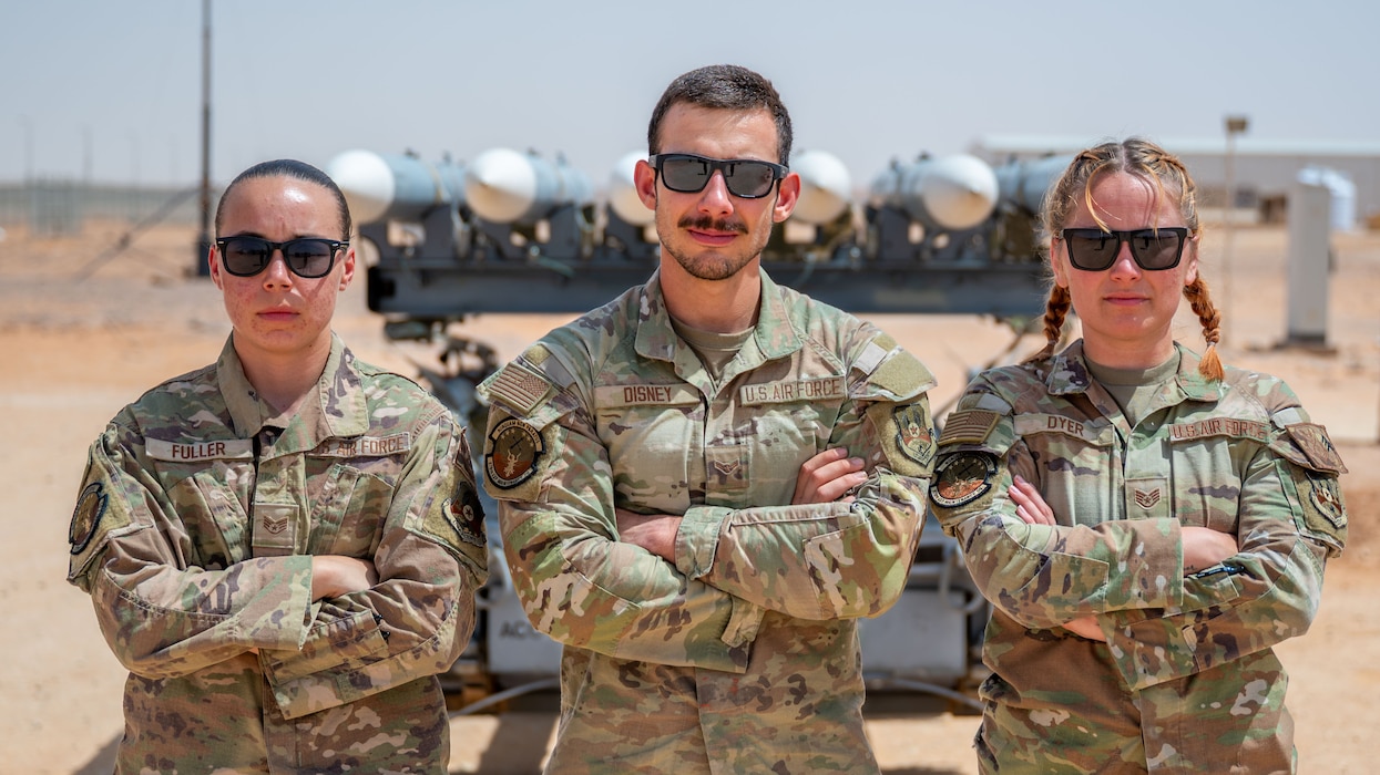A group of Airmen pose for a photo.