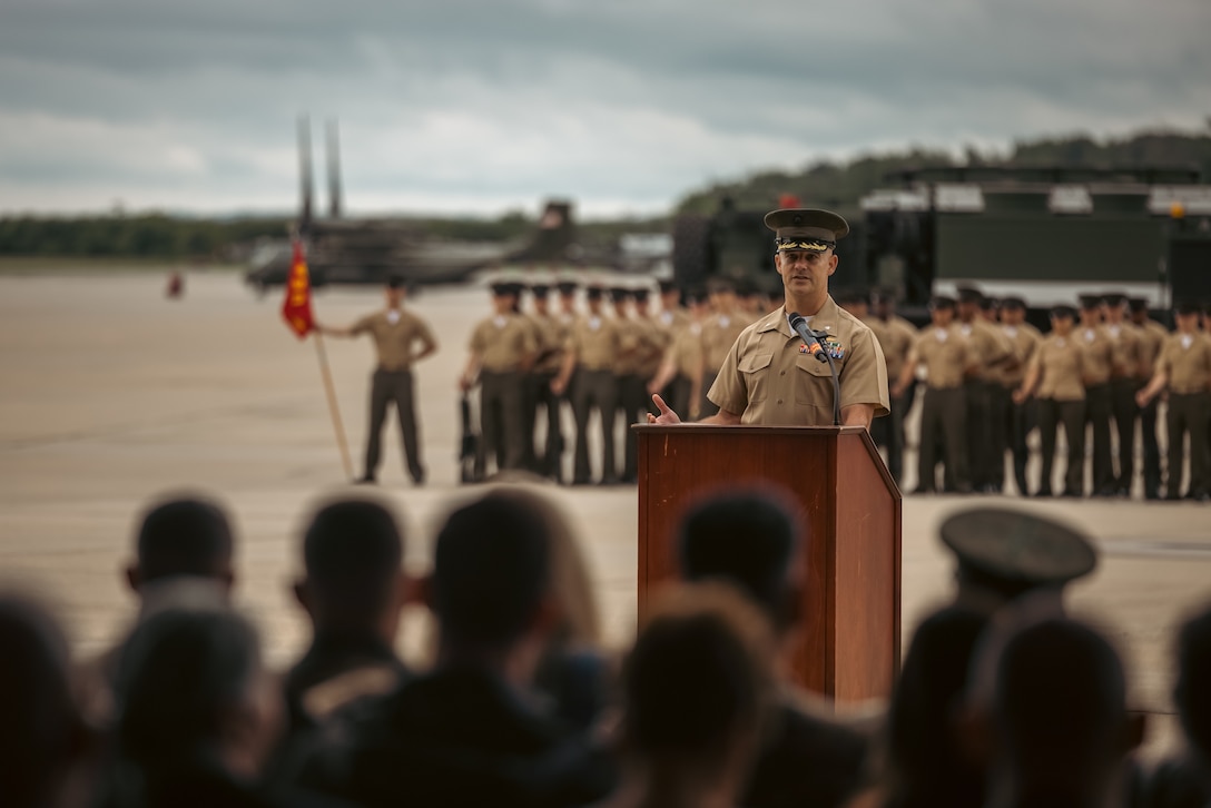 U.S. Marine Corps Lt. Col. Ethan Krumnow, incoming commanding officer, Marine Corps Air Facility Quantico, addresses the crowd during a change of command ceremony at MCAF on Marine Corps Base Quantico, Virginia, May 22, 2025. MCAF operates and maintains the facilities, and provides services and materiel to support the operations of Marine Helicopter Squadron 1 and other transient aircraft as required. (U.S. Marine Corps photo by Lance Cpl. Ethan Miller)