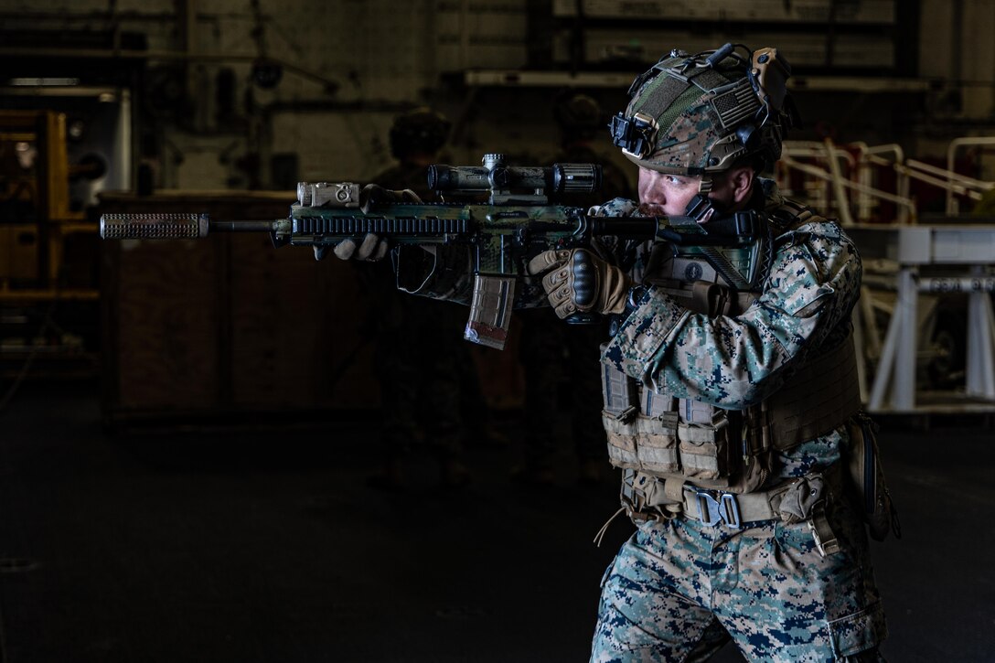 U.S. Marine Corps Cpl. Alex Carpenter, a rifleman with Kilo Company, Battalion Landing Team, 3rd Battalion, 6th Marine Regiment, 22nd Marine Expeditionary Unit, practices weapon maneuverability drills aboard the U.S. Navy Wasp-class amphibious assault ship USS Iwo Jima (LHD 7), in support of Iwo Jima Amphibious Ready Group Marine Expeditionary Unit Exercise while underway in the Atlantic Ocean, May 15, 2025. During ARGMEUEX, the 22nd MEU, aboard IWO ARG shipping, conducts various mission essential tasks that enhances operational readiness as a unified IWOARG/22 MEU team. (U.S. Marine Corps photo by Cpl. Emily Hazelbaker)