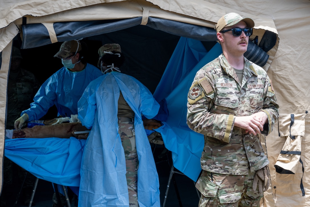 Staff Sgt. Shaun Reardon, 937th Training Support Squadron Ground Surgical Team course supervisor, briefs participants of the 2025 U.S. Central Command Medical Security Cooperation Exchange on Ground Surgical Team operations and capabilities during a tour of the Medical Readiness Training Center on Camp Bullis Military Training Reservation, Joint Base San Antonio – Fort Sam Houston, May 14, 2025. A GST consists of a six-person unit designed to provide far-forward, austere surgical care in combat zones. (U.S. Air Force photo by Joshua J. Garcia)