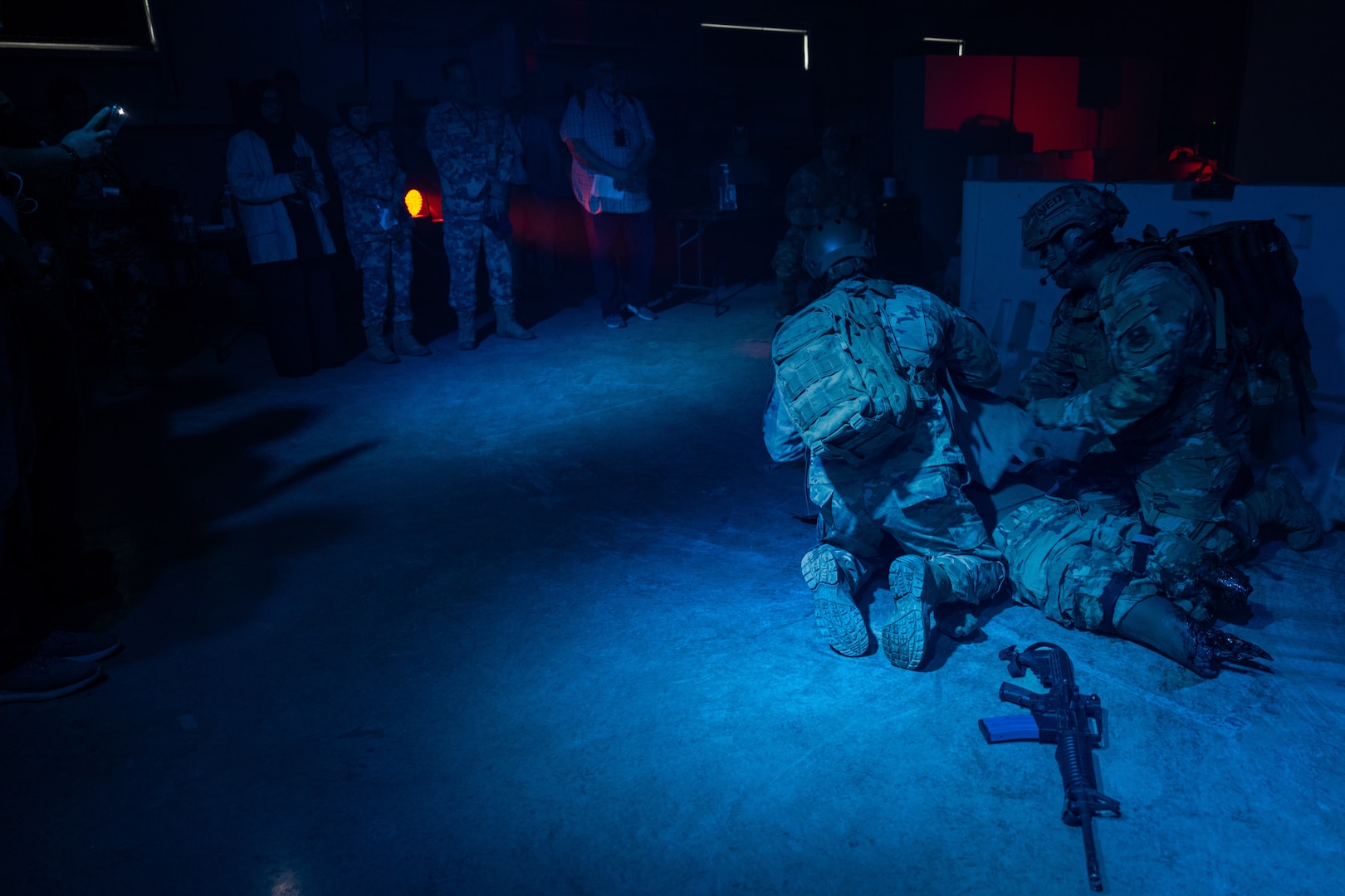 Master Sgt Justin Williamson and Staff Sgt. Gerardo Corona, both instructors with the 937th Training Support Squadron, demonstrate Tactical Combat Casualty Care to participants of the 2025 U.S. Central Command Medical Security Cooperation Exchange at the Medical Readiness Training Center on Camp Bullis Military Training Reservation, Joint Base San Antonio – Fort Sam Houston, May 14, 2025. The MRTC offers full-spectrum medical readiness training courses for all levels of medical knowledge, from brand new airmen to seasoned surgeons. (U.S. Air Force photo by Joshua J. Garcia)