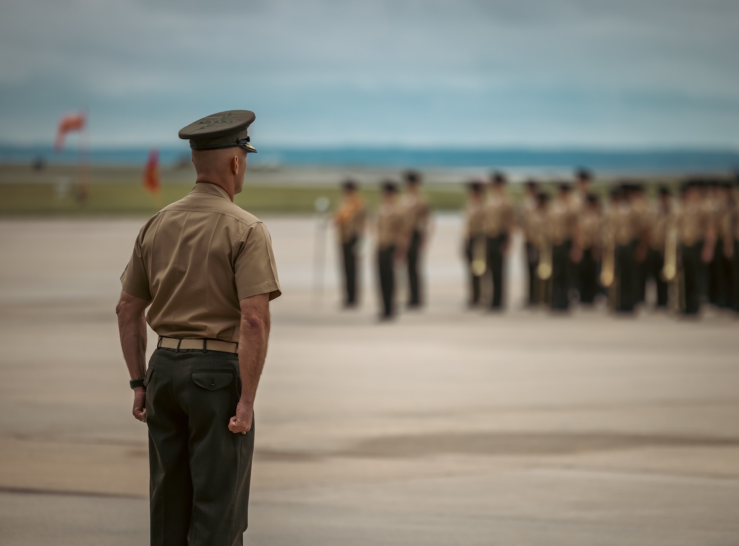 U.S. Marine Corps Col. Scott Warman, outgoing commanding officer, Marine Corps Air Facility Quantico, stands at attention during a change of command ceremony at MCAF on Marine Corps Base Quantico, Virginia, May 22, 2025. MCAF operates and maintains the facilities, and provides services and materiel to support the operations of Marine Helicopter Squadron 1 and other transient aircraft as required. (U.S. Marine Corps photo by Lance Cpl. Ethan Miller)