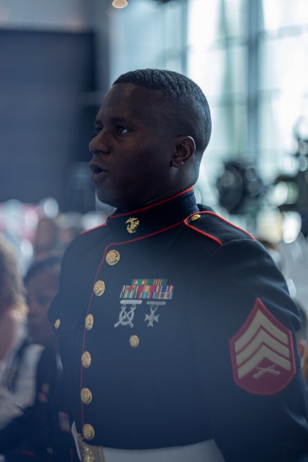 U.S. Marine Corps Sgt. Isaiah J. Curtis, color sergeant, Marine Forces Reserve and Marine Forces South, sings the Marines’ Hymn during the Armed Forces Day award ceremony at the National WWII Museum, May 17, 2025. Curtis is one of seven service members to be recognized for his dedication to service in the community. (U.S. Marine Corps photo by Cpl. Kanoa Thomas)