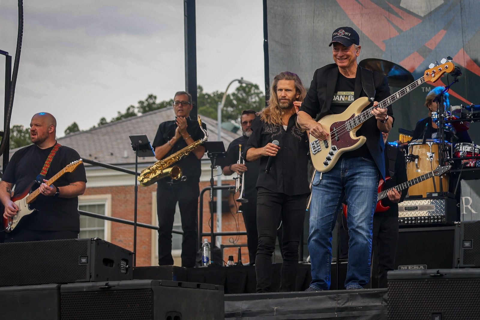 Residents of Marine Corps Base Quantico enjoy food and music at the Lt. Dan Band concert on Marine Corps Base Quantico, Virginia, May 23, 2025. The Lt. Dan Band is an American cover band, sponsored by the Gary Sinise Foundation, started by Gary Sinise and Kimo Williams to perform at United Service Organization shows, entertain troops, and raise money for disabled veterans. (U.S. Marine Corps photo by Lance Cpl. Jeffery Stevens)