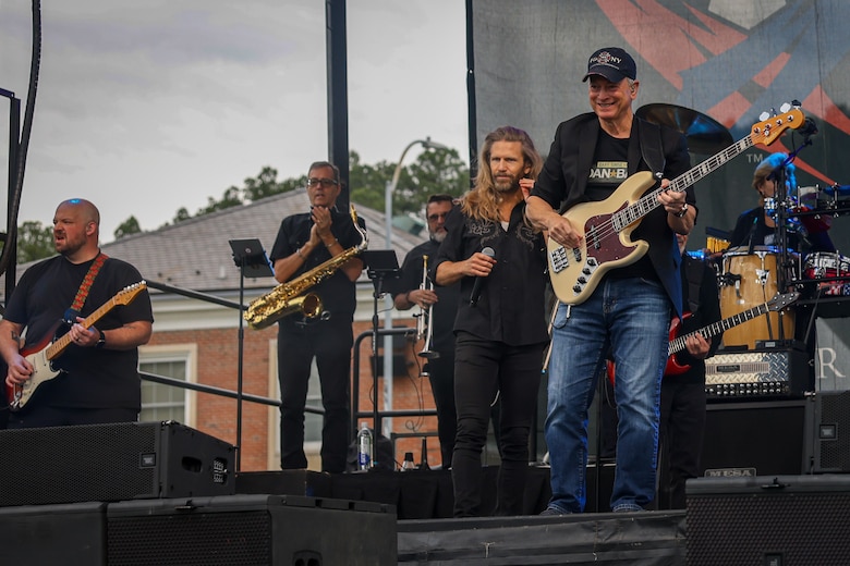 Residents of Marine Corps Base Quantico enjoy food and music at the Lt. Dan Band concert on Marine Corps Base Quantico, Virginia, May 23, 2025. The Lt. Dan Band is an American cover band, sponsored by the Gary Sinise Foundation, started by Gary Sinise and Kimo Williams to perform at United Service Organization shows, entertain troops, and raise money for disabled veterans. (U.S. Marine Corps photo by Lance Cpl. Jeffery Stevens)