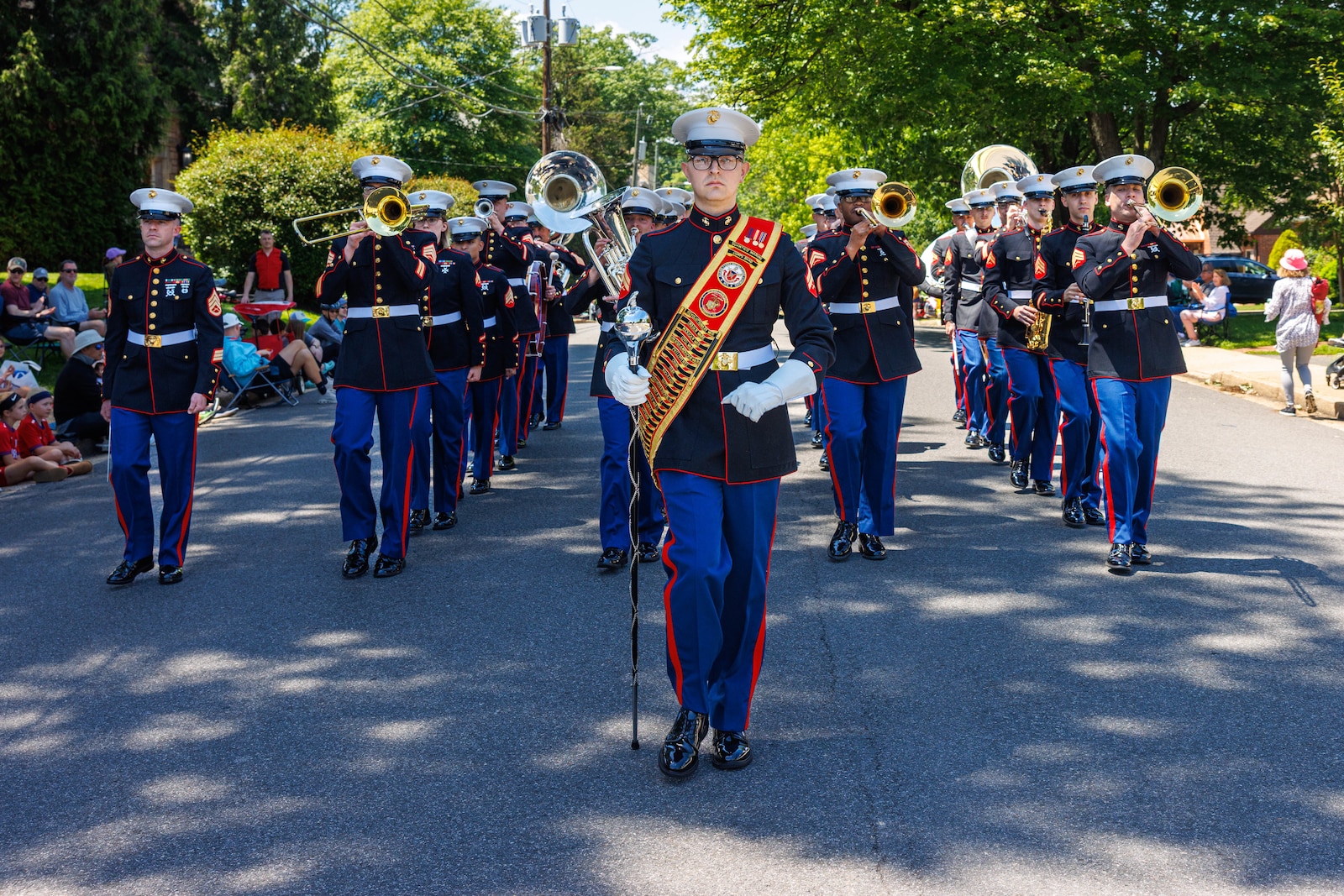 The Quantico Marine Band marches during the Memorial Day parade in the City of Falls Church, Virginia, May 26, 2025.  The City of Falls Church Memorial Day Parade is an annual event that honors the service members who have made the ultimate sacrifice.  (U.S. Marine Corps photo by Lance Cpl. Donovan E. Melendez)