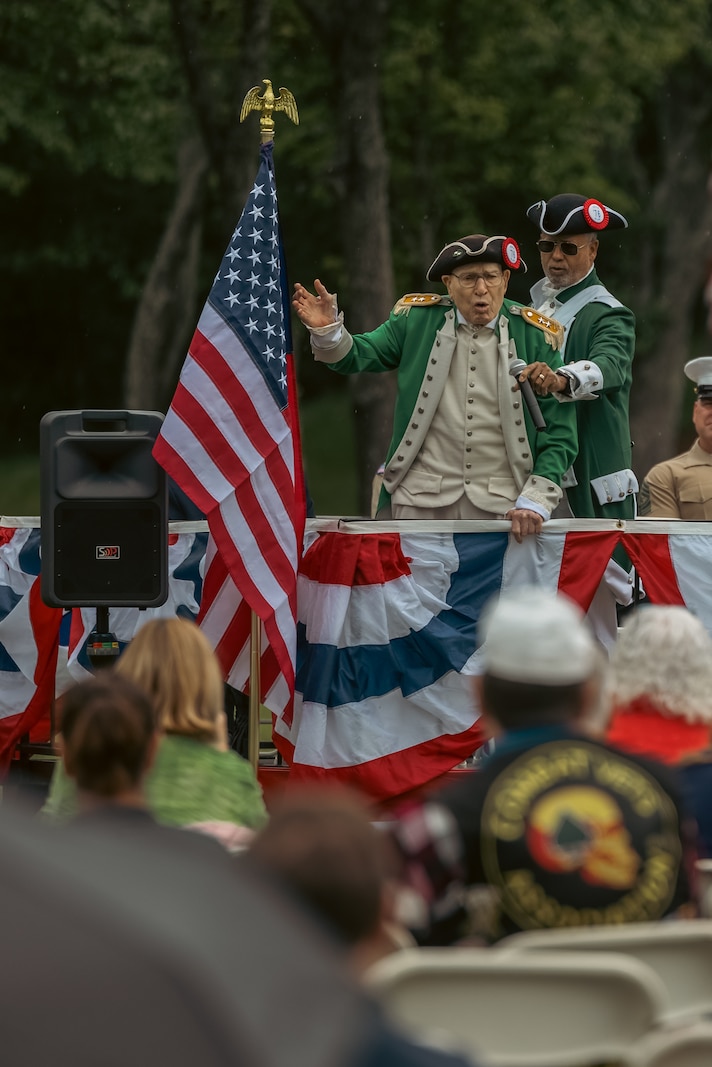 Retired U.S. Marine Corps Col. Frank Harris gives a toast to the flag during a Memorial Day ceremony at the National Memorial Cemetery at Quantico, Triangle, Virginia, May 26, 2025. The ceremony is held annually on Memorial Day weekend to honor the memory and military service of the service members buried there. (U.S. Marine Corps photo by Lance Cpl. Ethan Miller)