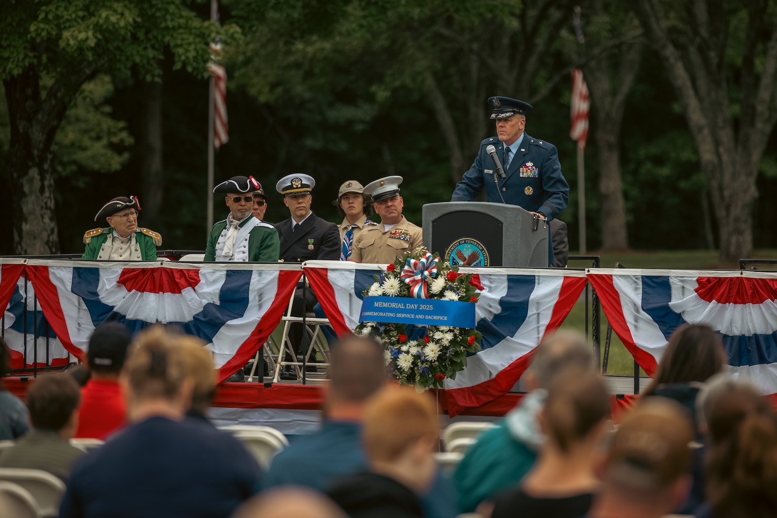 U.S. Air Force Brig. Gen. Sean Conroy, Air National Guard advisor to the assistant secretary of the Air Force, addresses the crowd during a Memorial Day ceremony at the National Memorial Cemetery at Quantico, Triangle, Virginia, May 26, 2025. The ceremony is held annually on Memorial Day weekend to honor the memory and military service of the service members buried there. (U.S. Marine Corps photo by Lance Cpl. Ethan Miller)