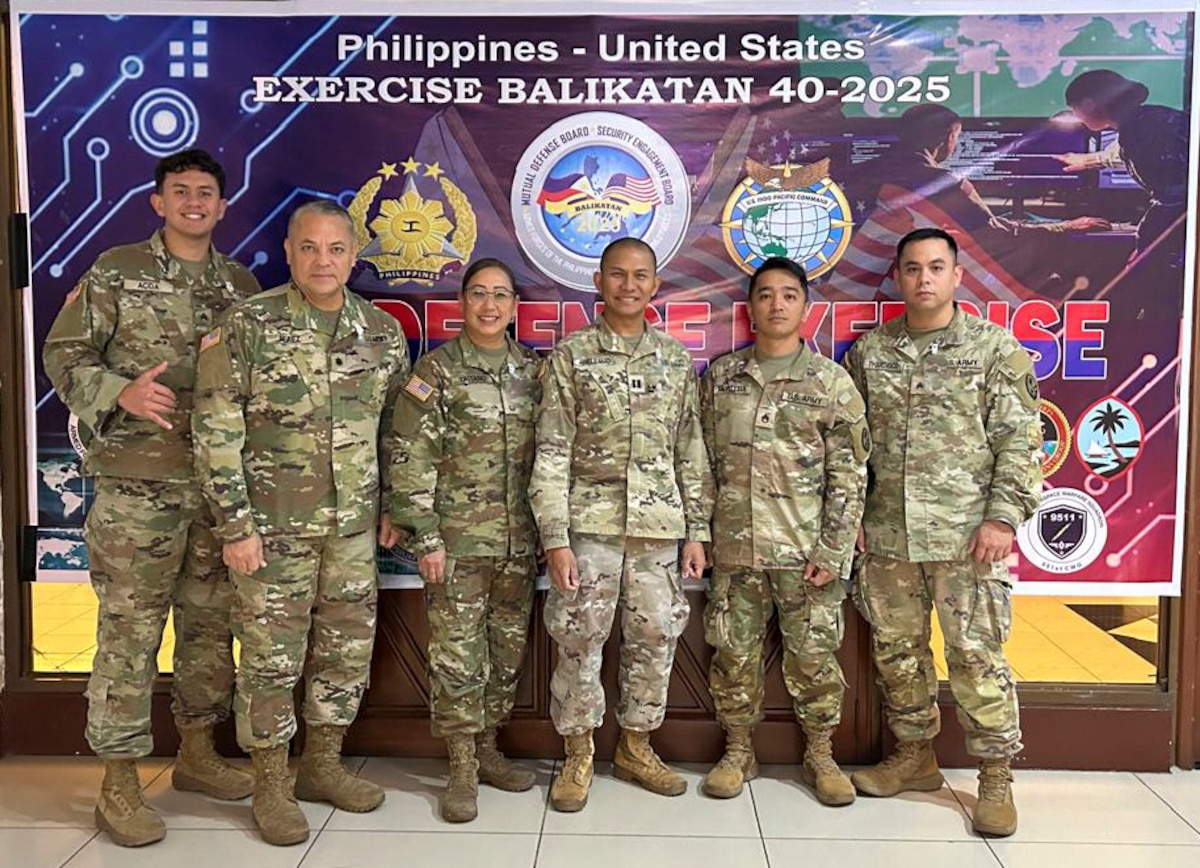 U.S. military members pose for a photograph during Balikatan Cyber Defense Exercise.