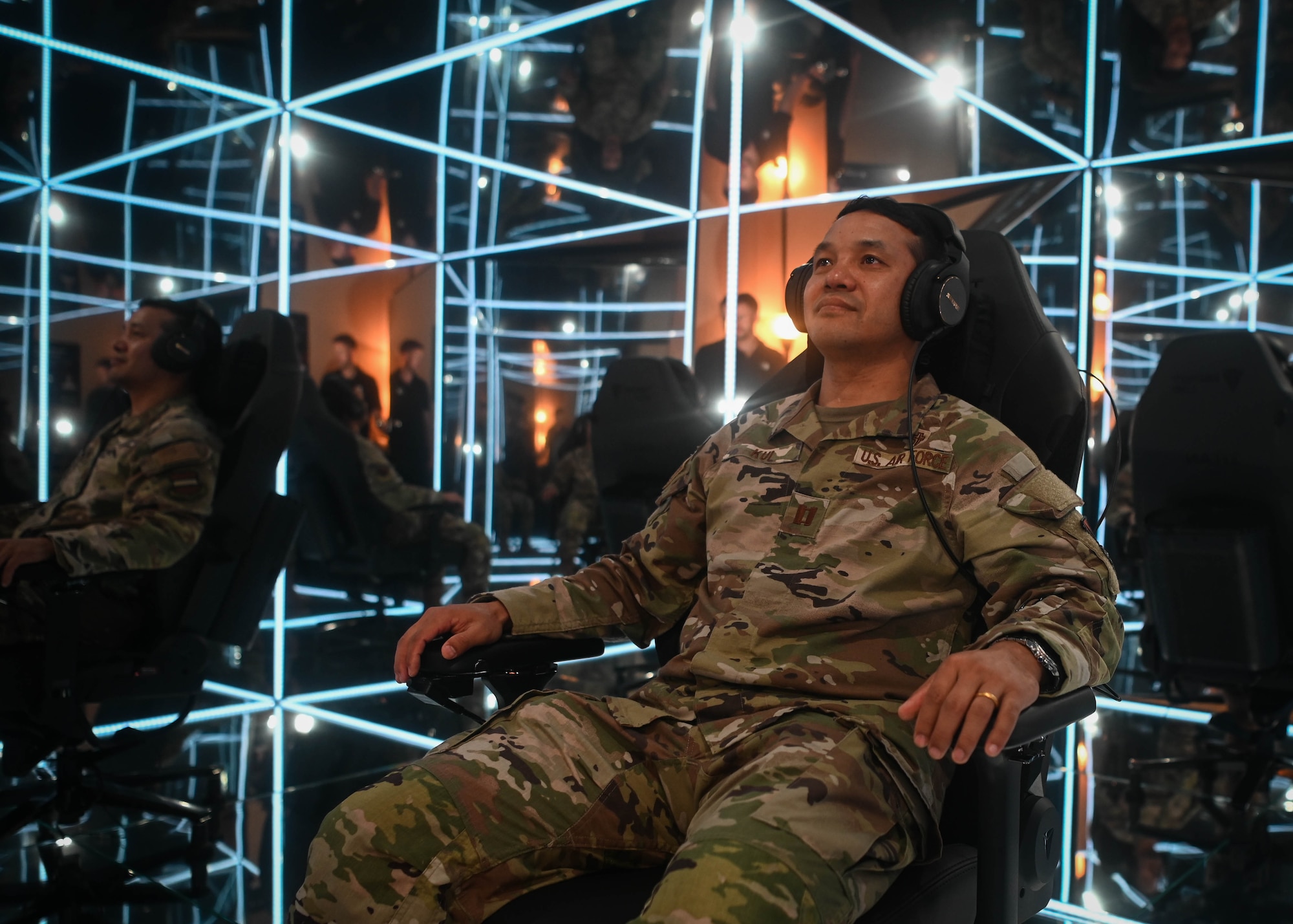 Capt. Simon Kui, 55th Wing chaplain, prepares to experience the new MindGym during its unveiling in building 323, May 15, 2025. MindGym is a seven-foot tall cube which uses light, reflection, calming sounds, and guided instruction as part of the immersive experience. (U.S. Air Force photo by Daniel Martinez)