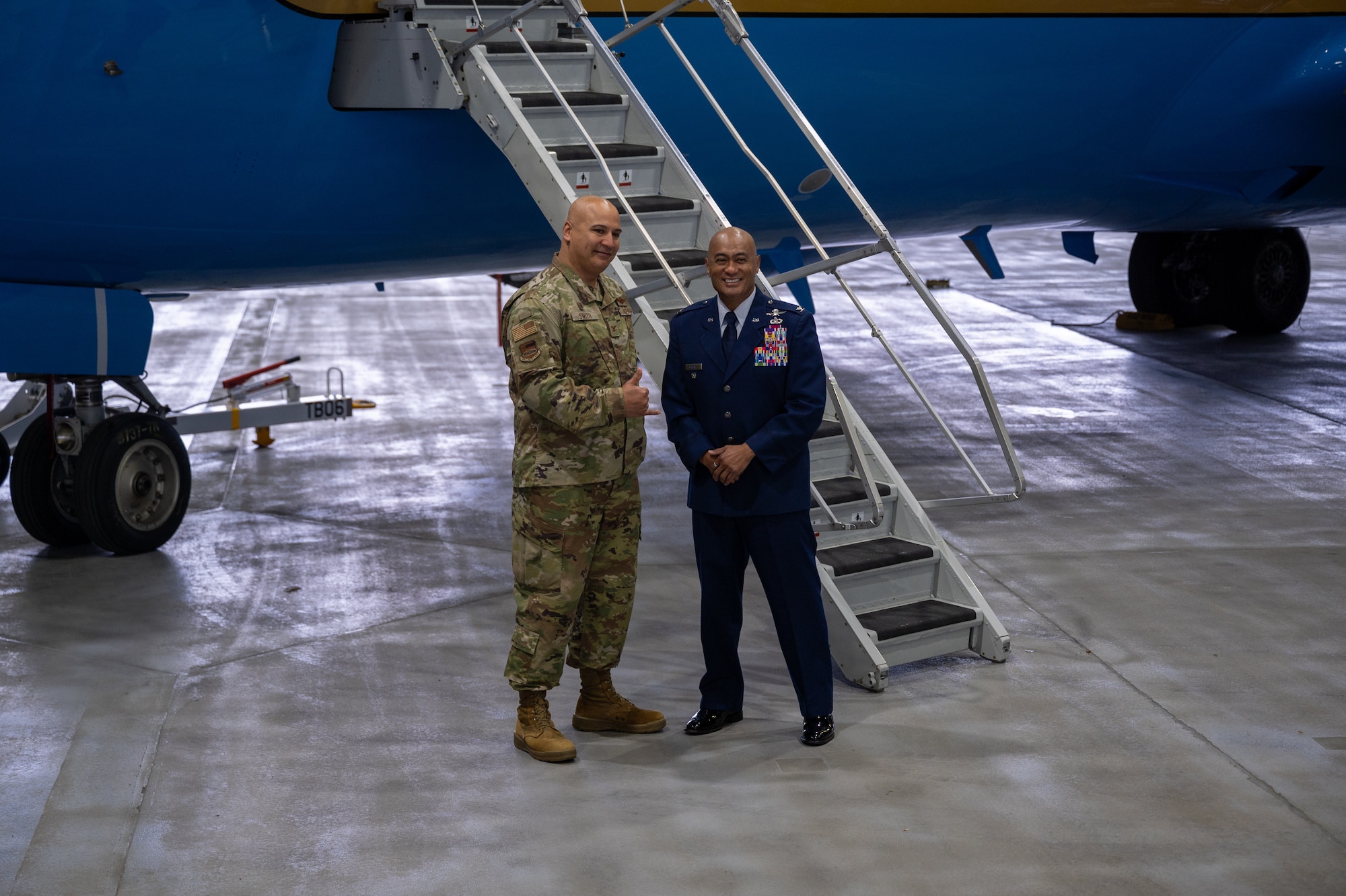 Col. Melchizedek Martinez (right) poses for a photo in front of a 932nd AW C-40C aircraft next to Col. Jeffrey Smith, 932nd AW commander after concluding his speech on resiliency to Gateway Wing Airmen during the 932nd AW Resilience Quest event May 3, 2025, Scott Air Force Base, Illinois.