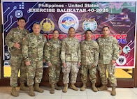 U.S. military members pose for a photo during Balikatan Cyber Defense Exercise.