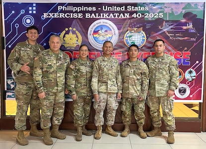 U.S. military members pose for a photo during Balikatan Cyber Defense Exercise.