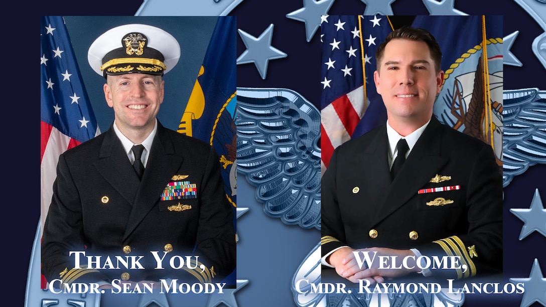 Two Navy officers in uniform.