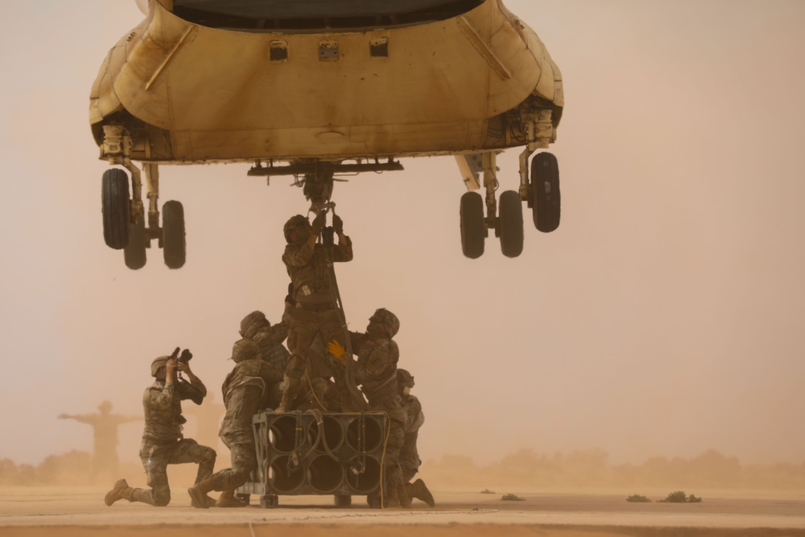U.S. Soldiers assigned to 3rd Battalion, 197th Field Artillery Regiment, New Hampshire Army National Guard, sling load a reduced range practice rocket to a Moroccan CH-47 Chinook during a multinational sling load operation at African Lion 2025 (AL25), May 17, 2025, in TanTan, Morocco.