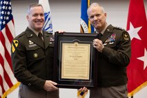 The ceremony was presided over by Lieutenant General Robert M. Collins
