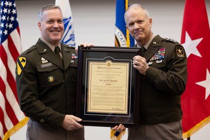 The ceremony was presided over by Lieutenant General Robert M. Collins