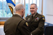 The ceremony was presided over by Lieutenant General Robert M. Collins