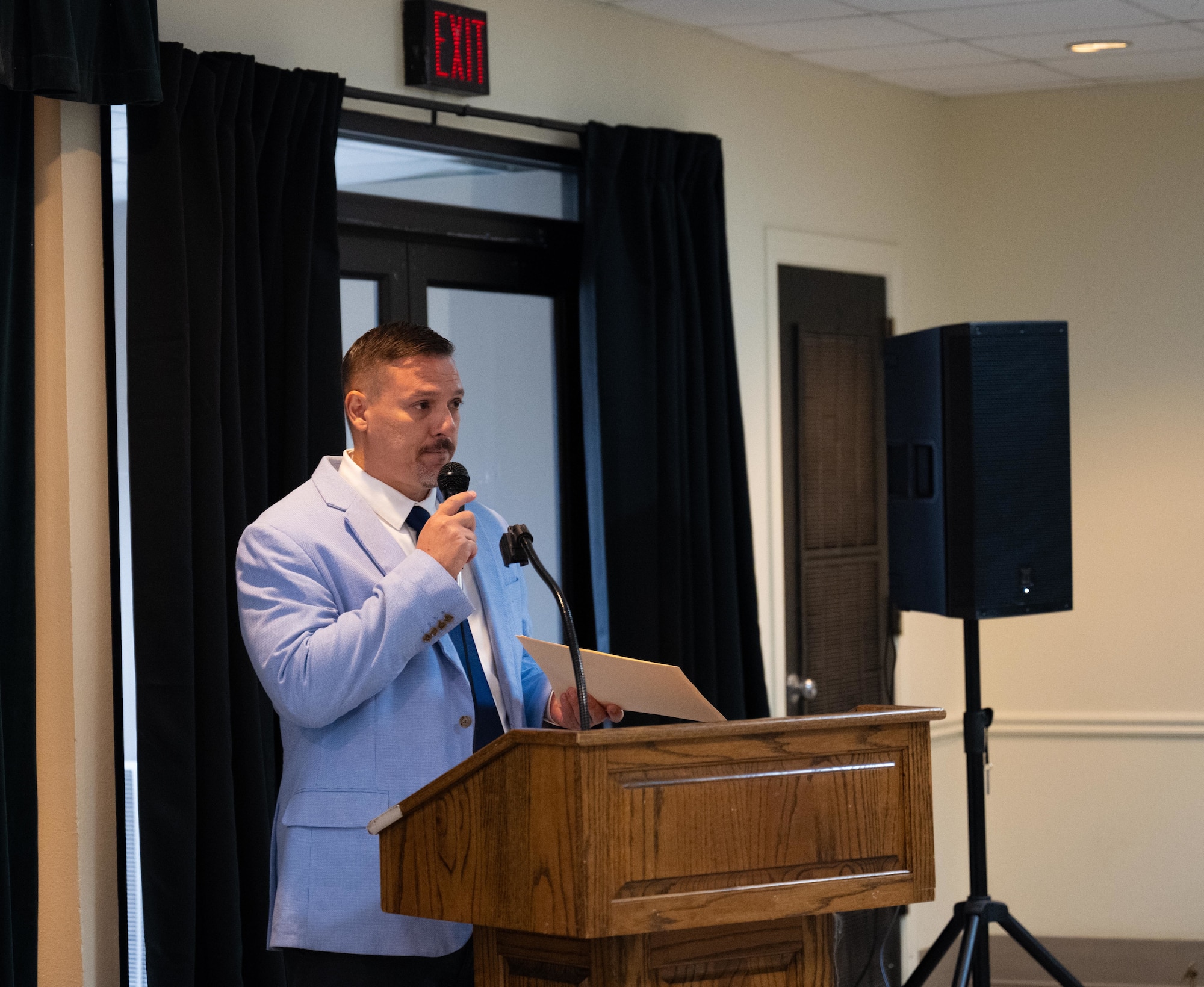 Jesus Perez, 47th Contracting Squadron, director of business operations, welcomes guests to Laughlin Small Business Industry Day expo at XL Landings , May 21, 2025. The event connected base leadership with local and regional business representatives to foster partnerships and promote opportunities within the defense contracting space. (U.S. Air Force photo by Airman 1st Class Harrison Sullivan)