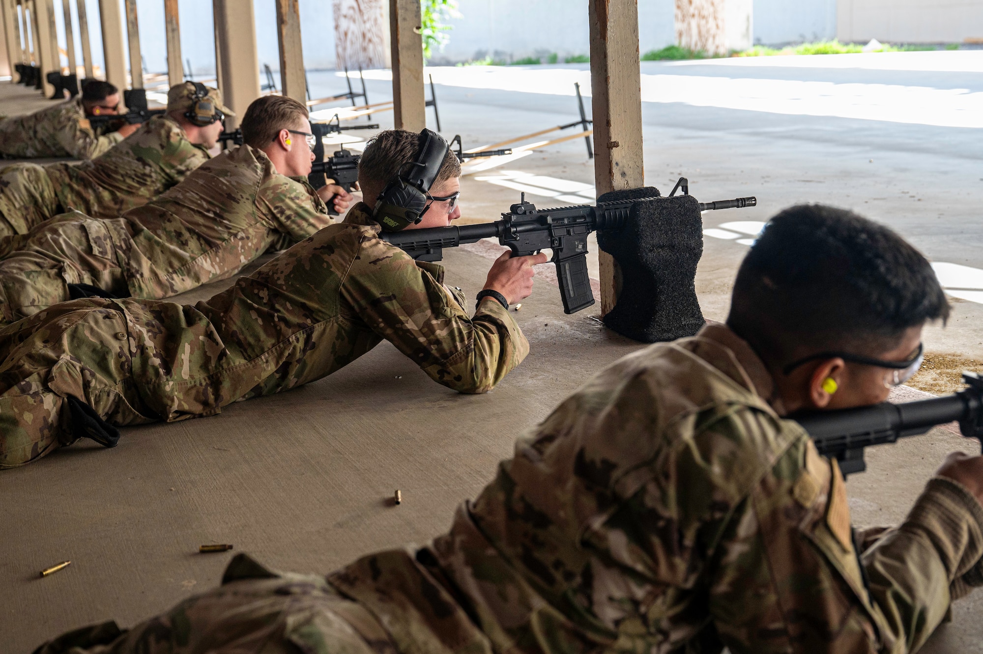 Members of Team Kirtland take aim during the Police Week shooting competition at Kirtland Air Force Base, May 20. During the competition, Airmen utilized the M4 rifle and competed against each other in a shooting match. (U.S. Air Force photo by Senior Airman Spencer Kanar)
