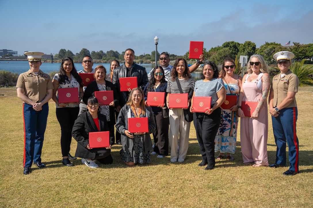 U.S. Marines and educators with Recruiting Station San Diego, 12th Marine Corps District, pose for a group photograph during an Educators’ Workshop event at Marine Corps Recruit Depot San Diego in San Diego, May 9, 2025. The Educators Workshop program provides selected educators and influential community members with an experiential opportunity to see how the Marine Corps transforms young men and women into Marines. The workshop also provides attendees with current information regarding Marine Corps training practices, military job skills, service opportunities, military lifestyle, and educational benefits available to Marines. (U.S. Marine Corps photo by Lance Cpl. Avery Wayland)