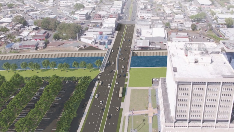 Rendering of a bridge over a river with a large parking lot next to the bridge.