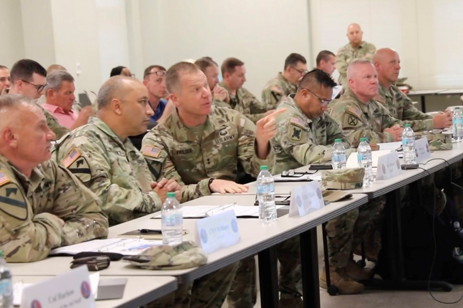 Maj. Gen. Thomas Friloux, adjutant general of Louisiana, discusses briefing details with Col. Augusto Villalaz, director of the Joint Staff for the Louisiana National Guard, during the annual Hurricane Rehearsal of Concept (ROC) Drill at the Armed Forces Reserve Center in Baton Rouge, Louisiana, May 21, 2025.