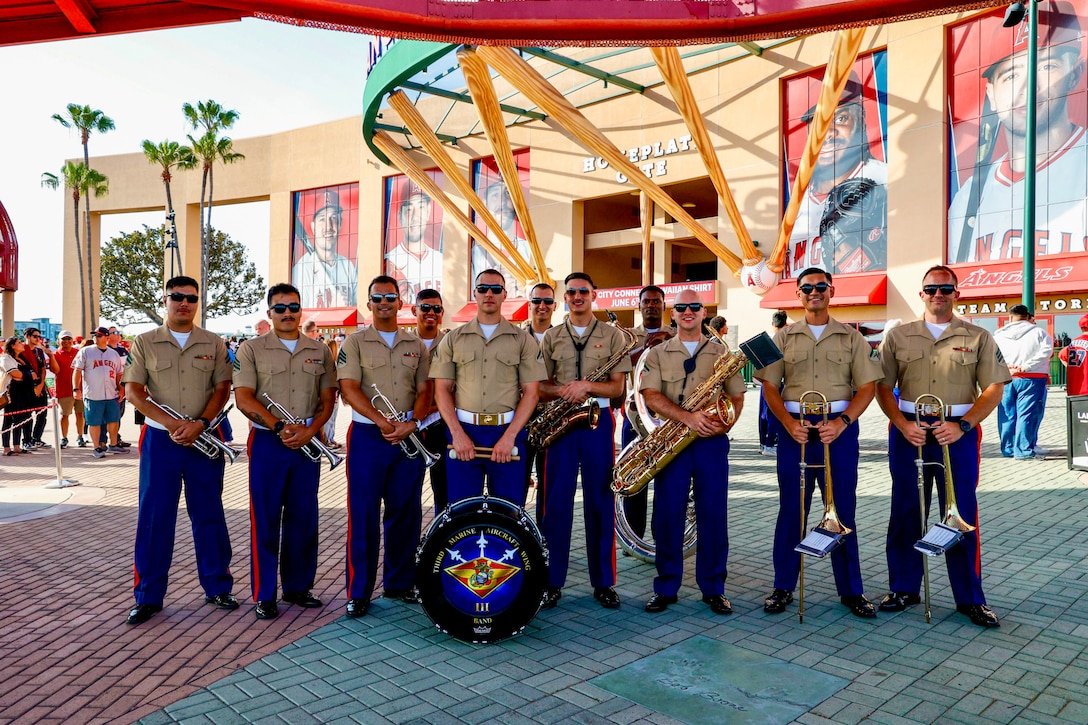 U.S. Marines with 3rd Marine Aircraft Wing Band pose for a photograph at Angel Stadium in Anaheim, California, during Los Angeles Fleet Week, May 24, 2025. Los Angeles Fleet Week, now in its eighth iteration, is a sea service celebration that allows citizens of Greater Los Angeles to witness today’s maritime capabilities firsthand. Nearly 1,000 Sailors, Marines, and Coast Guardsmen will showcase their capabilities and equipment, participate in various community service events, and enjoy the hospitality of Los Angeles during the event. (U.S. Marine Corps photo by Gunnery Sgt. Courtney G. White)