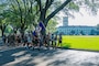 A group of Airmen at Barksdale Air Force Base, Louisiana, jog with the security forces flag during a 24-hour Police Week ruck, May 22, 2025. The 24-hour ruck was one of the many events held to commemorate Police Week. (U.S. Air Force photo by Airman 1st Class Aaron Hill)