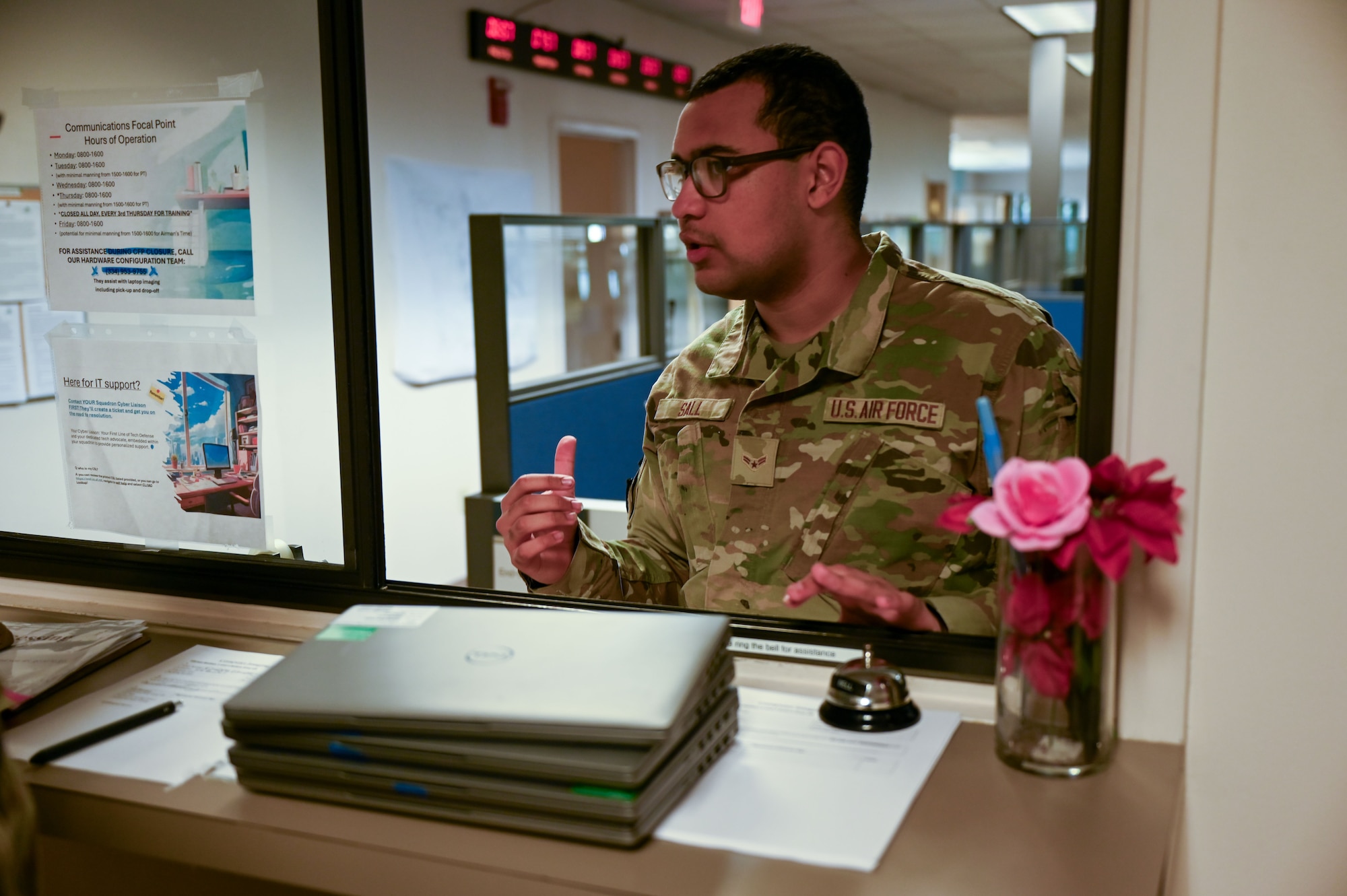 U.S. Air Force Airman 1st Class Mohamed Sall, 42nd Communications Squadron communication focal point focal point technician, speaks with an Airman about reformatting his computer at Maxwell Air Force Base, Alabama, May 20, 2025.