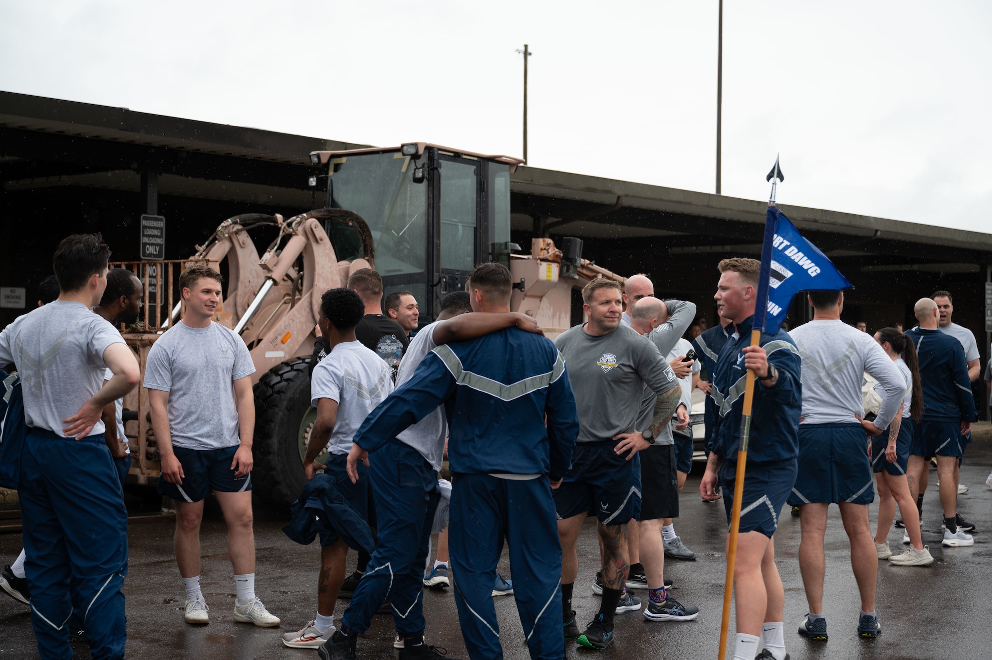 U.S. Air Force Aerial Port Squadrons from multiple wings at Joint Base McGuire-Dix-Lakehurst, N.J., connect with one another after finishing the annual Port Dawg Memorial Run May 21, 2025. Port Dawgs across the Air Force gather each year to run in honor of those who lost their lives in their career field. (U.S. Air Force photo by Airman Haeleigh Bayle)