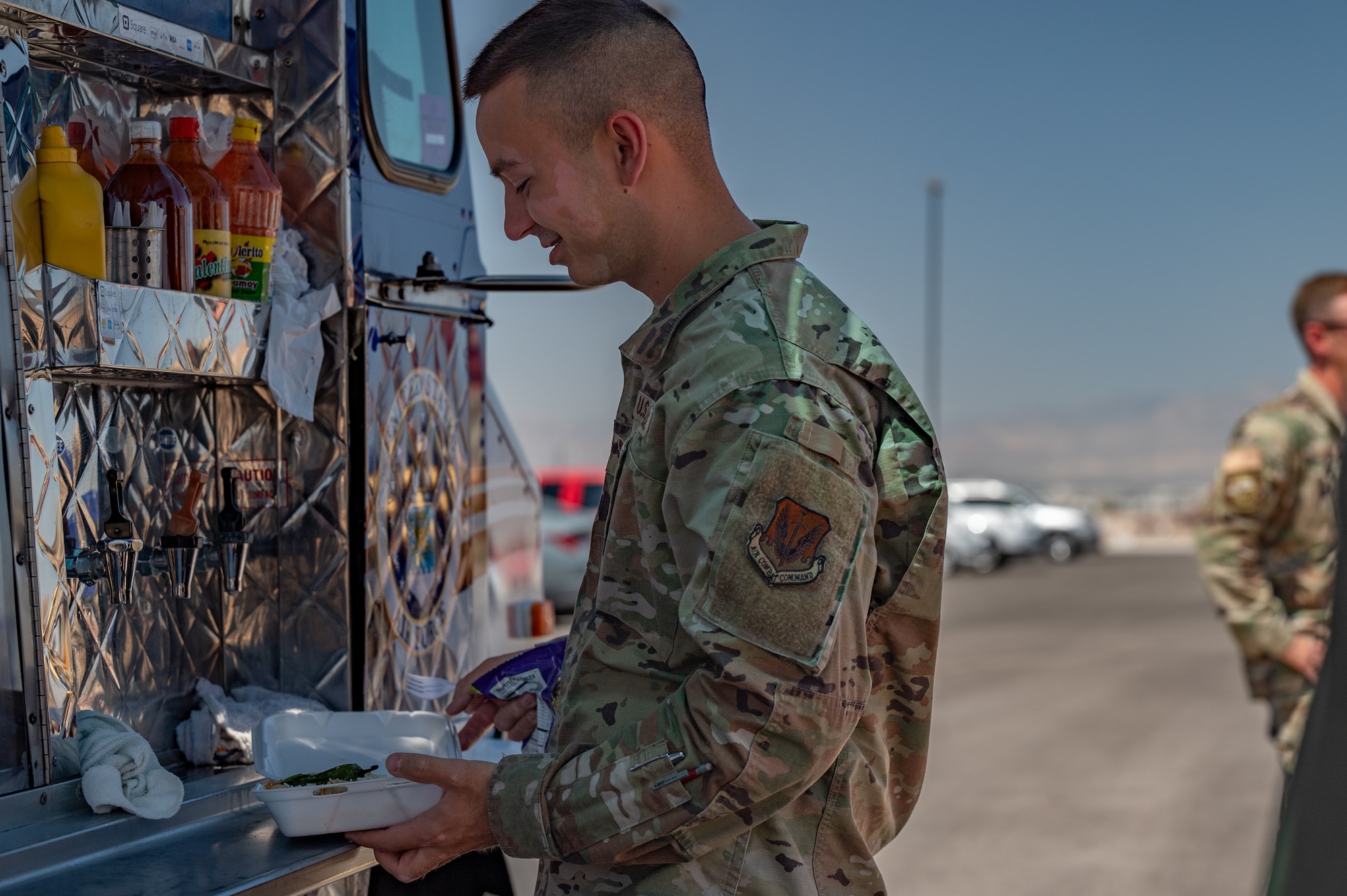 Airmen standing in line.