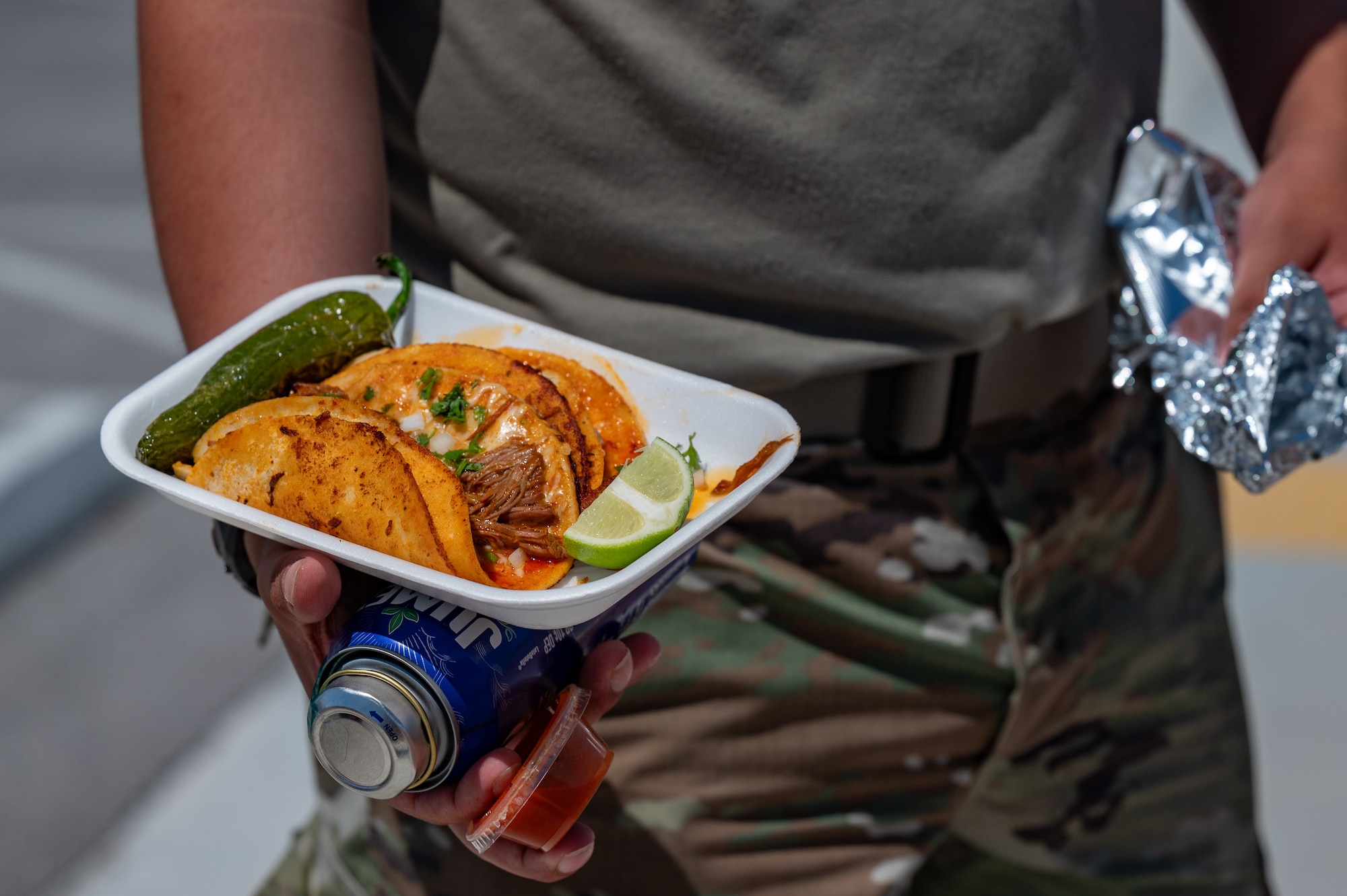 Airmen holding food