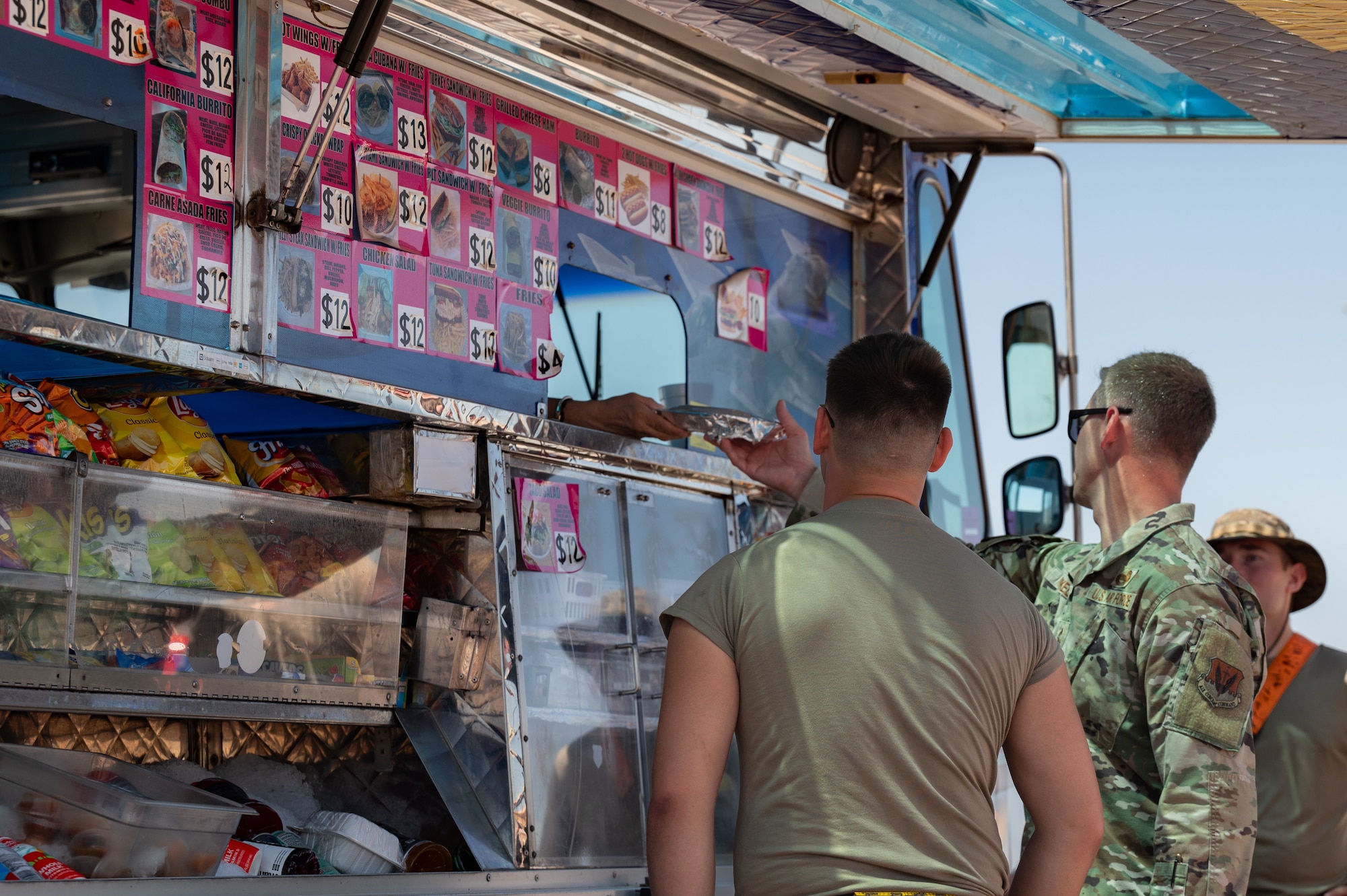 People stand at food truck