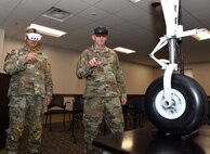 Sgt. 1st Class Yun Sung, left, and Master Sgt. William Harbeson try out augmented reality technology that could be an option for use in the military sustainment community during a Healthcare Technology Management Week summit, hosted by U.S. Army Medical Logistics Command May 21-22 at Fort Detrick, Maryland.