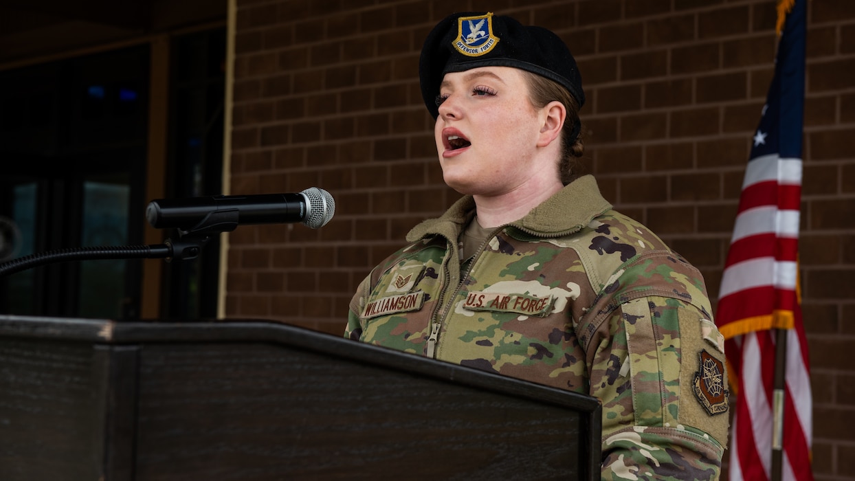 Airman sings the natonal anthem