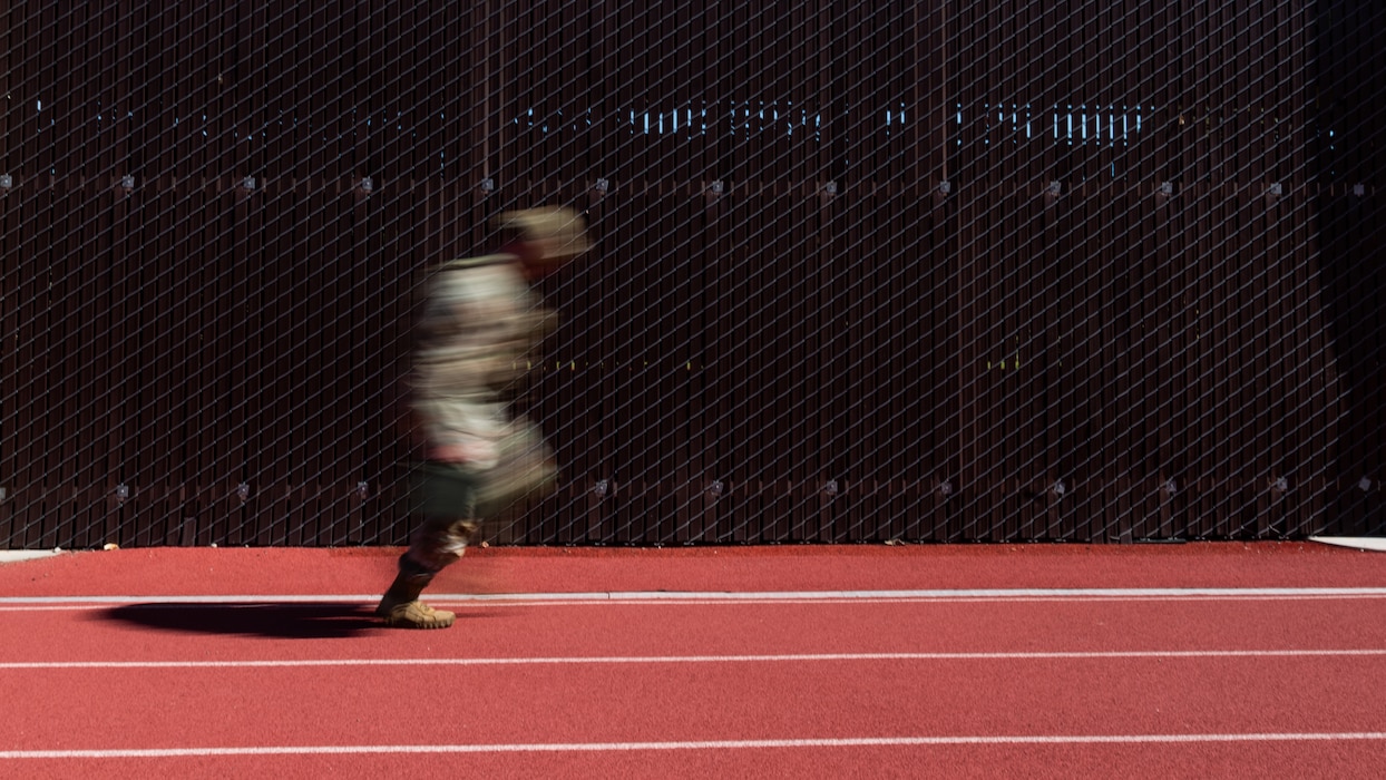 Airman running on track