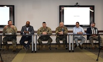 Healthcare technology management leaders from the Army, Air Force, Navy and Defense Health Agency participate in a senior leader panel during a HTM Week summit May 21 at Fort Detrick, Maryland. Pictured, from left, are Chief Warrant Officer 5 Lee Nelson, Reginald “Reggie” Burrus, Chief Warrant Officer 4 Jerry Schmaljohann, Chief Master Sgt. Brady Garrett, Mario Brito and Heath Brunson.