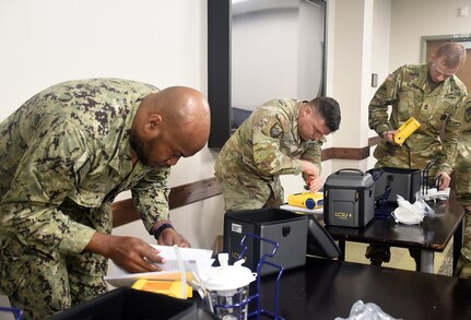 Army and Navy medical maintainers participate in a team-building event during a Healthcare Technology Management Week summit, hosted by U.S. Army Medical Logistics Command May 21-22 at Fort Detrick, Maryland. (U.S. Army photo by Katie Ellis-Warfield/Released)