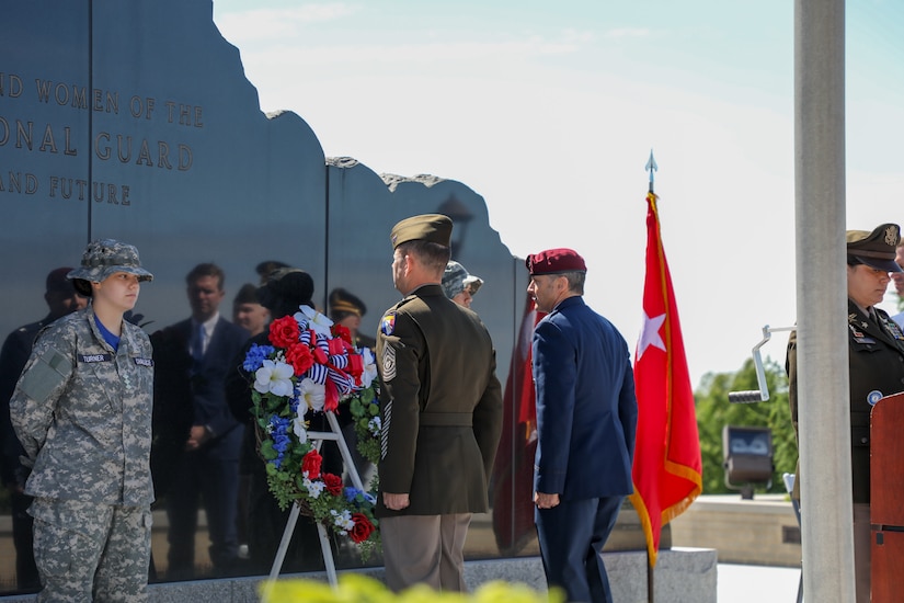 U.S. Army Command Sgt. Maj. Jesse Withers, Kentucky's state command sergeant major, and U.S. Air Force Col. Aaron Zamora, commander of the 123rd Contingency Response Group, place a wreath to honor those who lost their lives in service to their country during the Memorial Day remembrance ceremony held at the Kentucky National Guard memorial at Boone National Guard Center in Frankfort, Kentucky, May 26, 2025.