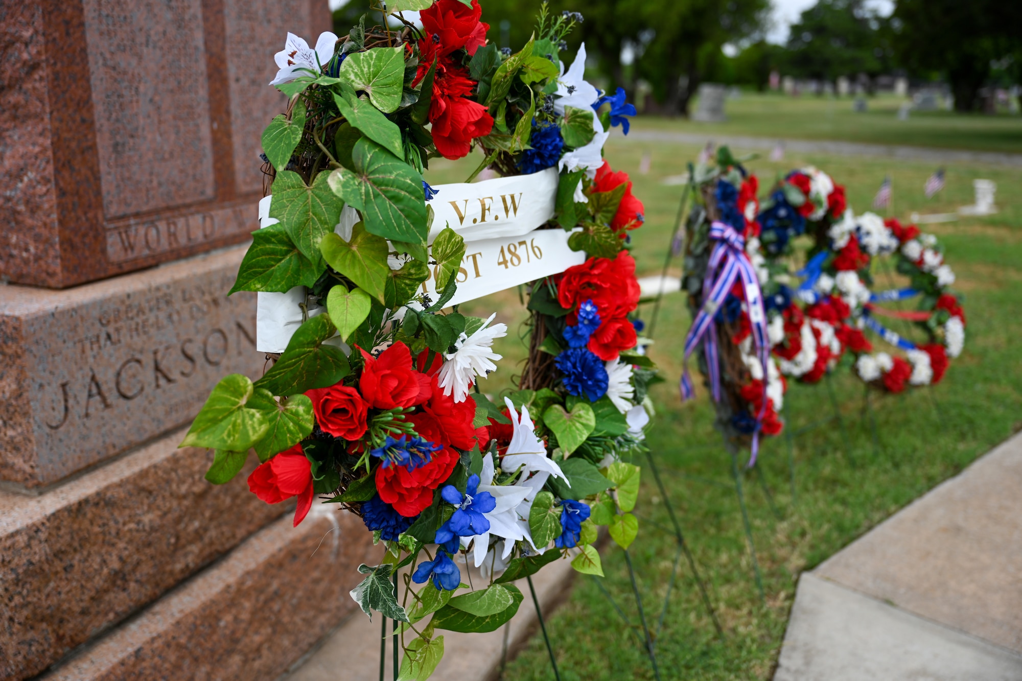 Memorial Day wreaths are laid out at the Altus City Cemetery in Altus, Oklahoma, May 26, 2025. Placing wreaths by gravestones signifies remembrance, gratitude, and honor for the generations of fallen heroes who gave their life. (U.S. Air Force photo by Airman 1st Class Nathan Langston)