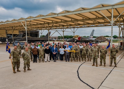 Personnel assigned to 502nd Communication Squadron and 149th Fighter Wing who participated in the "One Base One Network" initiative pose for a photo at Joint Base San Antonio-Lackland, Texas, April 29, 2025. This initiative integrates the Texas Air National Guard 149FW into the Department of the Air Force enterprise network on JBSA-Lackland to consolidate multiple networks under a single, secure and efficient platform that enhances cybersecurity, improves mission effectiveness and streamlines operations for all mission partners. (U.S. Air Force photo by Zelideth Rodriguez)