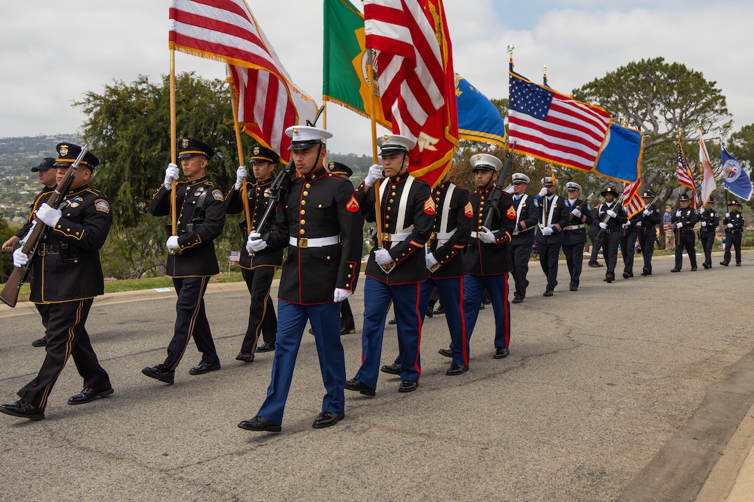 U.S. service members participate in a Memorial Day observance at Green Hills Memorial Park in Rancho Palos Verdes, California, during Los Angeles Fleet Week, May 26, 2025. Los Angeles Fleet Week, now in its eighth iteration, is a sea service celebration that allows citizens of Greater Los Angeles to witness today’s maritime capabilities firsthand. Nearly 1,000 Sailors, Marines, and Coast Guardsmen will showcase their capabilities and equipment, participate in various community service events, and enjoy the hospitality of Los Angeles during the event. (U.S. Marine Corps photo by Cpl. Bruin Largent)