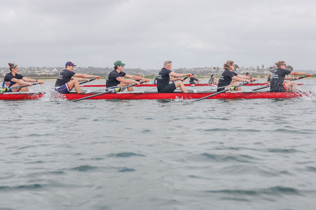 U.S. Marines and members of U.S. Rowing participate in an exhibition race during the San Diego Crew Classic at Crown Point Beach in San Diego, California, March 29, 2025. The San Diego Crew Classic brings junior, collegiate, masters, elite, and para competitors together across a weekend of races at Crown Point Shores. (U.S. Marine Corps photo by Cpl. Alejandro Fernandez)